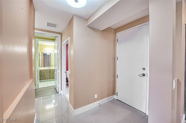 11701 Olivetti Ln Unit 307, Fort Myers, FL 33908 - corridor featuring baseboards, visible vents, and tile patterned flooring