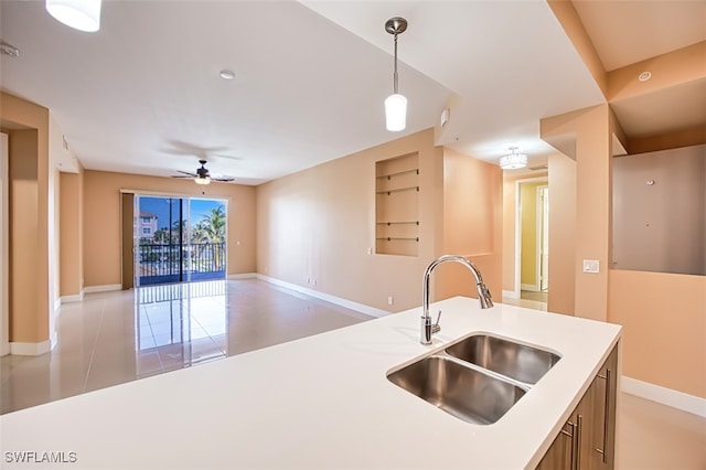 11701 Olivetti Ln Unit 307, Fort Myers, FL 33908 - kitchen with a ceiling fan, pendant lighting, a sink, light countertops, and open floor plan