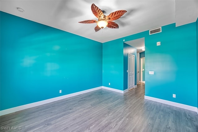 11701 Olivetti Ln Unit 307, Fort Myers, FL 33908 - unfurnished room featuring baseboards, a ceiling fan, wood finished floors, and visible vents