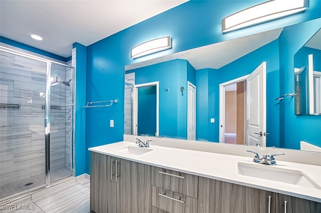 11701 Olivetti Ln Unit 307, Fort Myers, FL 33908 - bathroom with double vanity, a shower stall, and a sink