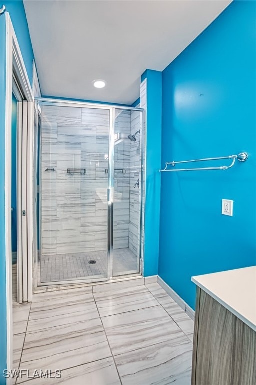 11701 Olivetti Ln Unit 307, Fort Myers, FL 33908 - bathroom with recessed lighting, tile patterned floors, baseboards, and a stall shower