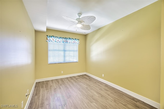 empty room featuring ceiling fan and light wood-type flooring