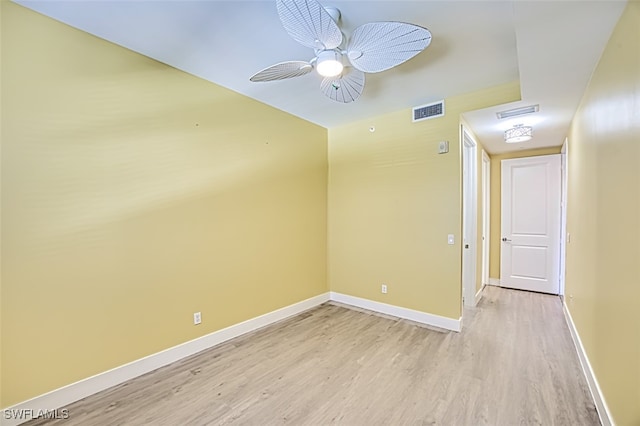 spare room with light hardwood / wood-style flooring and ceiling fan