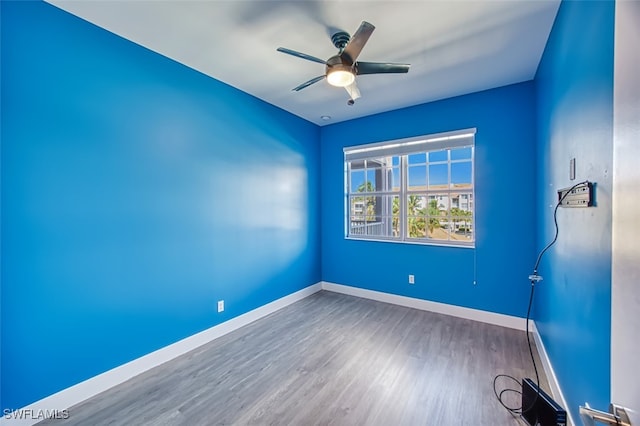 unfurnished room featuring wood-type flooring and ceiling fan