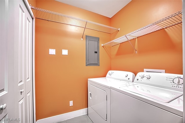 11701 Olivetti Ln Unit 307, Fort Myers, FL 33908 - washroom featuring washing machine and clothes dryer, laundry area, tile patterned flooring, baseboards, and electric panel