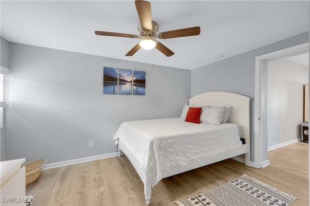 bedroom featuring hardwood / wood-style flooring and ceiling fan