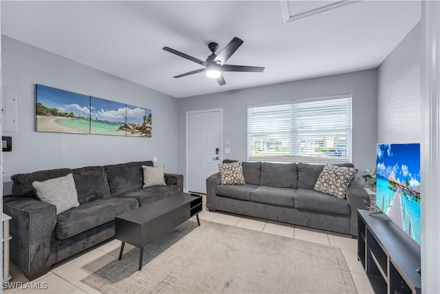 tiled living room featuring ceiling fan