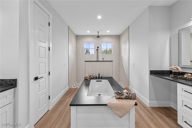 bathroom featuring vanity and hardwood / wood-style flooring