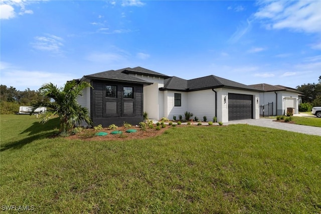 14081 Carlos St, Fort Myers, FL 33905 - prairie-style home with driveway, an attached garage, and a front yard