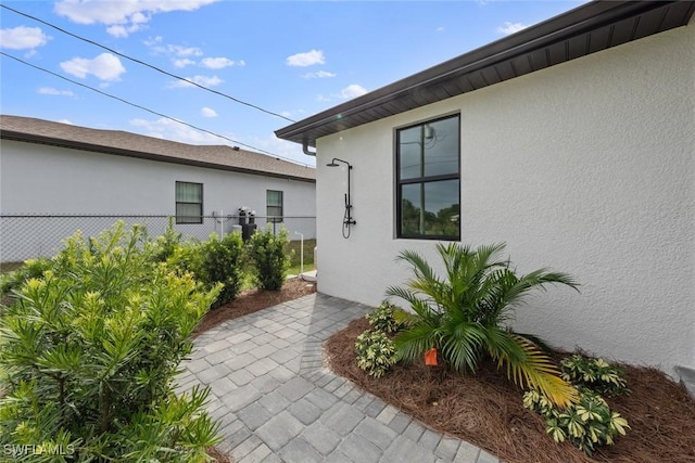 14081 Carlos St, Fort Myers, FL 33905 - doorway to property with stucco siding