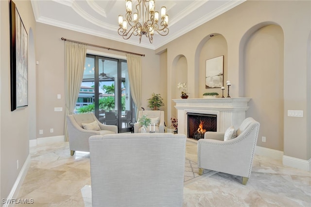 sitting room with an inviting chandelier, crown molding, and a raised ceiling