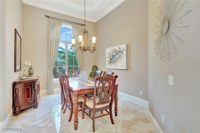 dining area with ornamental molding and a chandelier