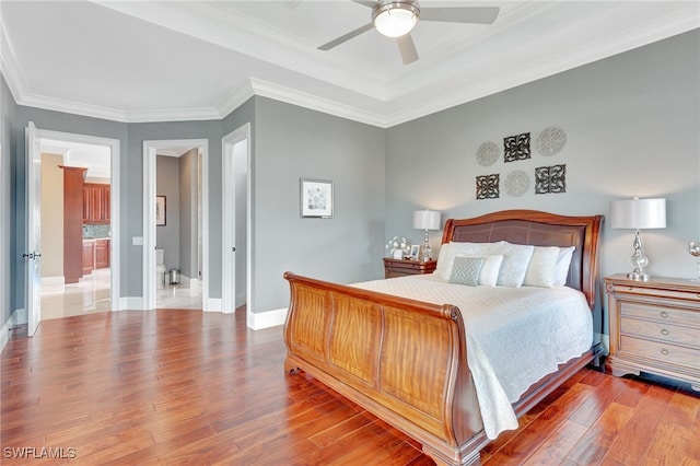 bedroom featuring ceiling fan, light hardwood / wood-style flooring, and ornamental molding