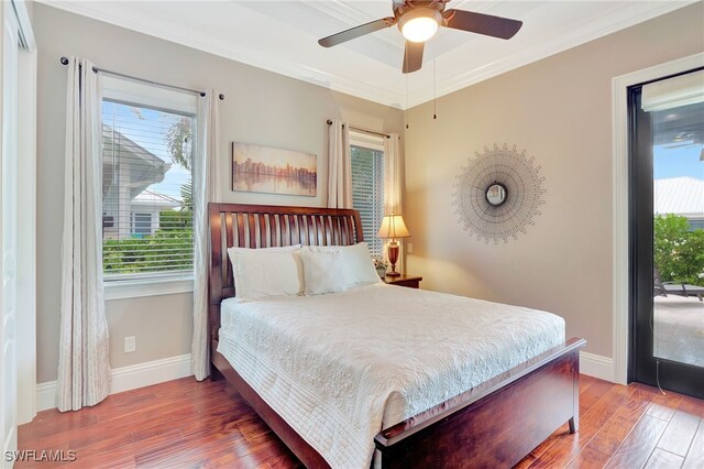 bedroom featuring ceiling fan, crown molding, and hardwood / wood-style flooring