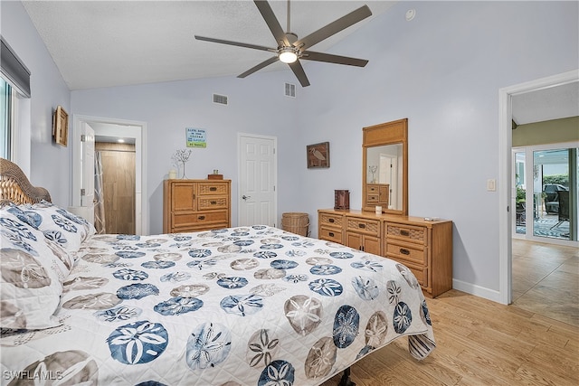 bedroom with light wood-type flooring, a textured ceiling, access to exterior, ceiling fan, and vaulted ceiling