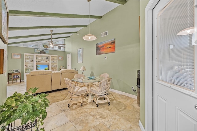 dining space featuring vaulted ceiling with beams and ceiling fan