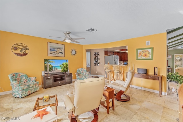 living room with ceiling fan