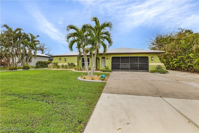 ranch-style home with a front yard and a garage