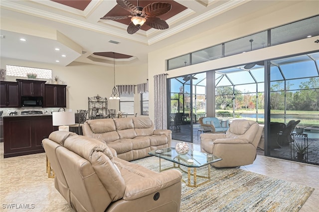 living room with ornamental molding, coffered ceiling, a high ceiling, and ceiling fan