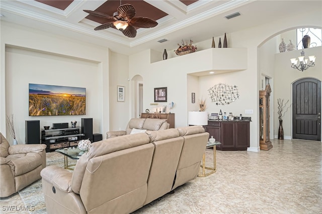 living room featuring coffered ceiling, beamed ceiling, ornamental molding, a towering ceiling, and ceiling fan with notable chandelier