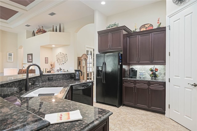 kitchen featuring dark brown cabinets, dark stone countertops, ornamental molding, sink, and black appliances