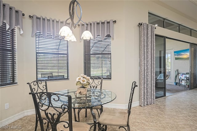 tiled dining space featuring plenty of natural light