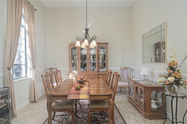 dining space featuring an inviting chandelier and plenty of natural light