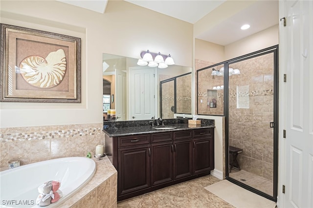 bathroom with vanity, tile patterned floors, and shower with separate bathtub