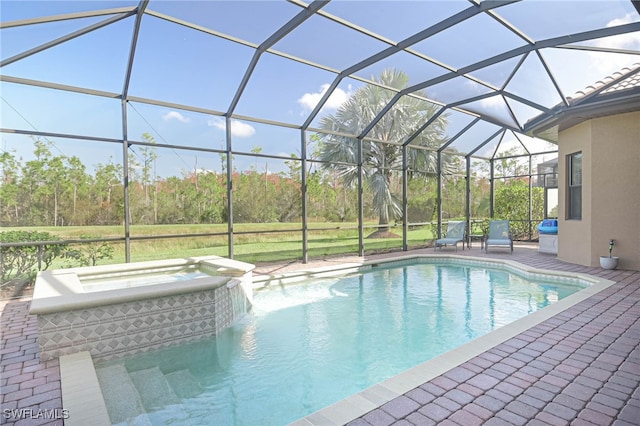 view of swimming pool with an in ground hot tub, a patio, and glass enclosure