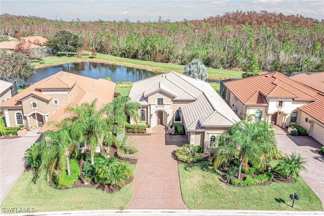 birds eye view of property with a water view