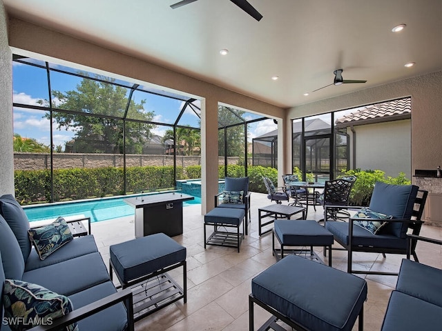 view of patio / terrace featuring a lanai and ceiling fan