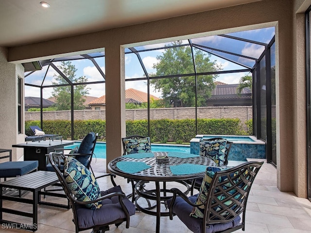 view of patio with a swimming pool with hot tub and a lanai