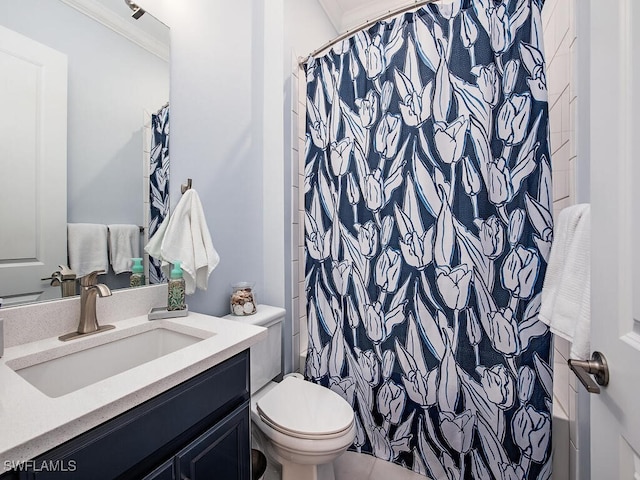 bathroom featuring vanity, toilet, and walk in shower