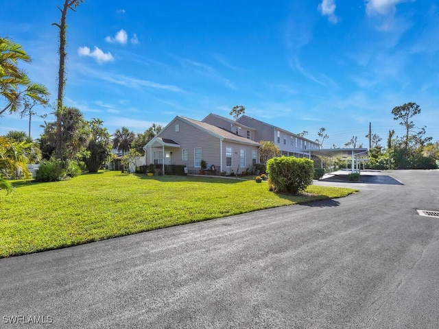 view of side of home featuring a yard