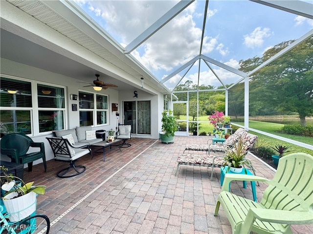 view of patio with a lanai and ceiling fan