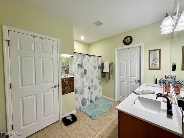 bathroom featuring vanity, curtained shower, and tile patterned floors