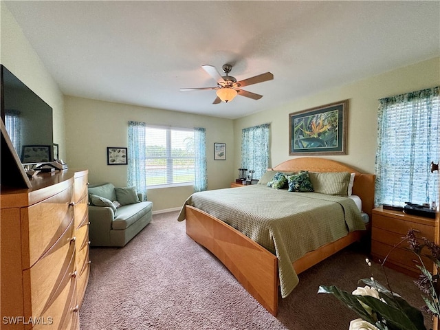 bedroom with ceiling fan and carpet flooring