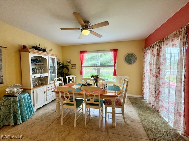 dining room with light tile patterned flooring and ceiling fan