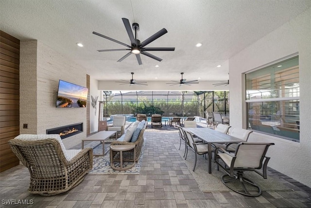 view of patio featuring ceiling fan, an outdoor hangout area, and outdoor dining area