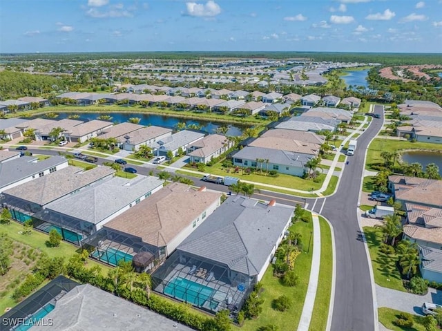 aerial view with a residential view and a water view