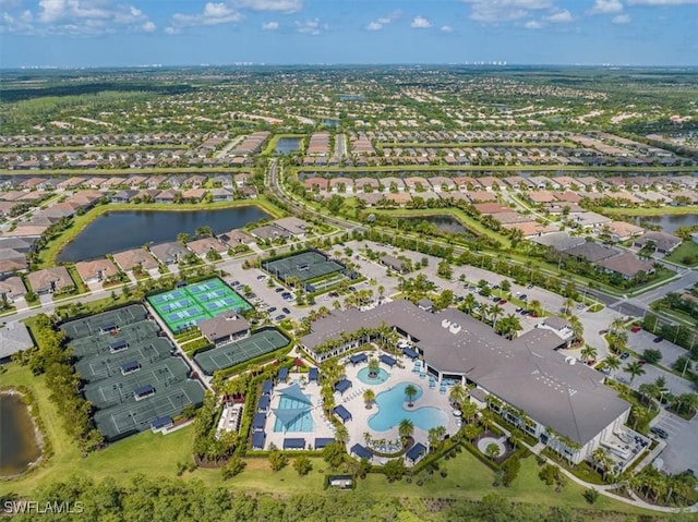 birds eye view of property with a residential view and a water view
