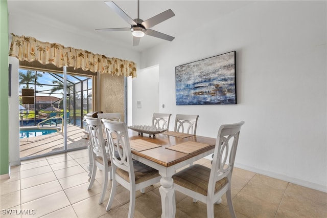 dining room with ceiling fan and light tile patterned flooring