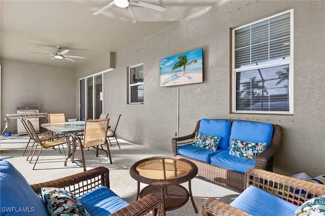 view of patio featuring grilling area, an outdoor living space, and ceiling fan