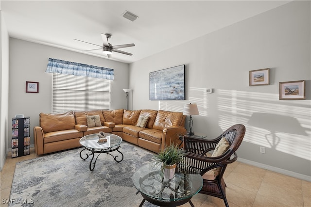 tiled living room with ceiling fan