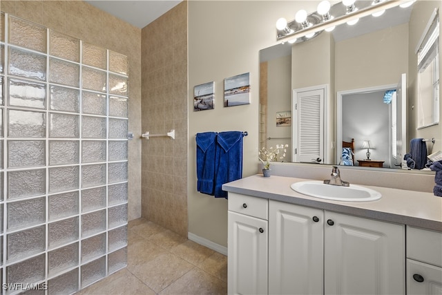 bathroom with tile patterned flooring and vanity