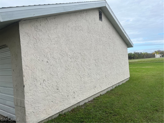 view of side of home featuring a yard