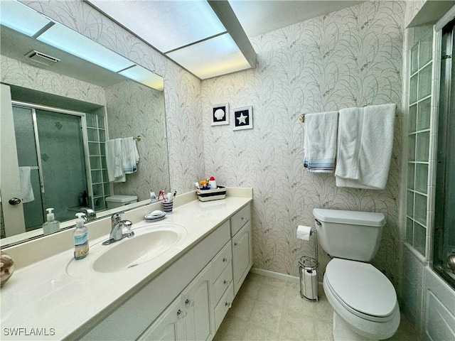 11220 Caravel Cir Unit 305, Fort Myers, FL 33908 - full bathroom with toilet, an enclosed shower, baseboards, wallpapered walls, and vanity