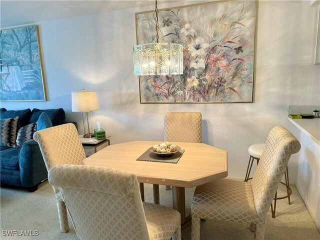 11220 Caravel Cir Unit 305, Fort Myers, FL 33908 - dining space with carpet floors and a chandelier