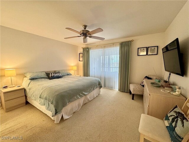 11220 Caravel Cir Unit 305, Fort Myers, FL 33908 - bedroom featuring light carpet and ceiling fan