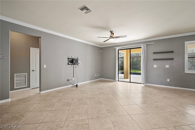 spare room with crown molding, a textured ceiling, light tile patterned flooring, and ceiling fan